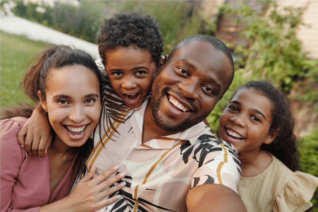 A family smiling together at home